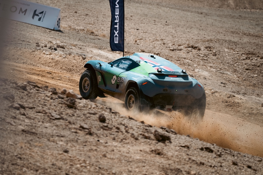 Extreme E car kicking up desert dust on Continental tyres
